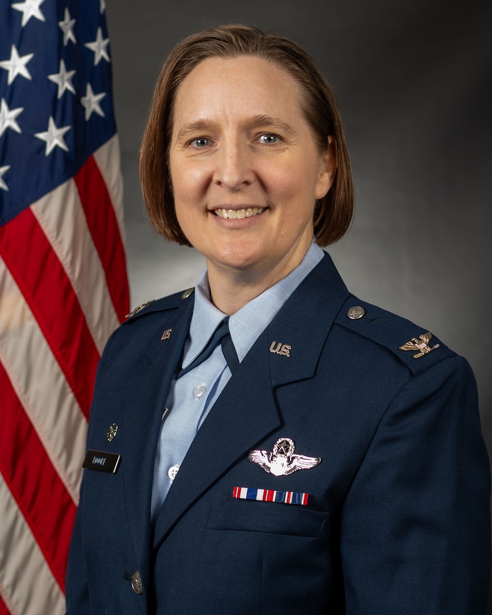 Official studio portrait of Col Jen Moore, 126th Operations Group commander, in U.S. Air Force dress blues.