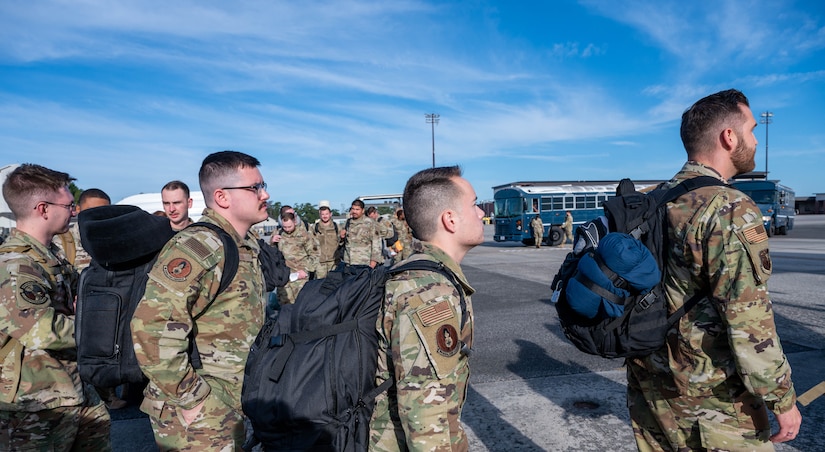 A photo of Airmen waiting on the flightline.