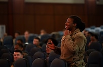 A photo of an audience member asking a question.