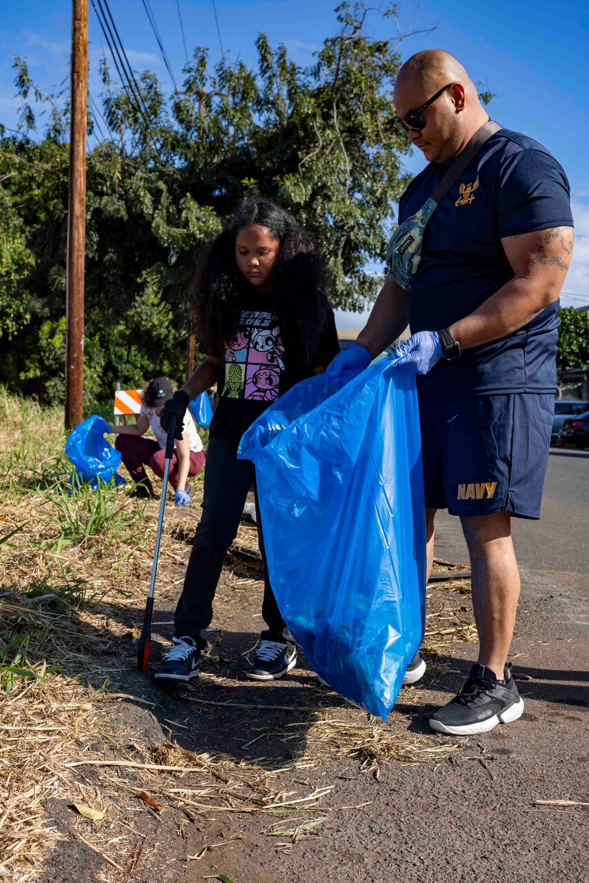 WAIPAHU, Hawaii (April 20, 2024) Volunteers from Navy Closure Task Force-Red Hill (NCTF-RH) team up with residents and other community members to clean trash and debris along the Kamakahi Stream and a portion of the bike trail. The volunteer event, sponsored by the City and County of Honolulu, brought together residents  and various organizations from across the community in recognition of Earth Day 2024. Charged with the safe decommissioning of the Red Hill Bulk Fuel Storage Facility, NCTF-RH was established by the Department of the Navy as a commitment to the community and the environment.. (U.S. Navy photo by Mass Communication Specialist 1st Class Luke McCall)