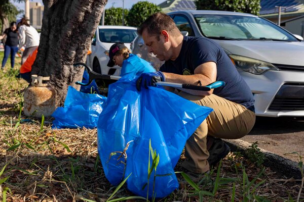 WAIPAHU, Hawaii (April 20, 2024) Volunteers from Navy Closure Task Force-Red Hill (NCTF-RH) and Commander, Navy Region Hawaii, team up with residents and other community members to clean trash and debris along the Kamakahi Stream and a portion of the bike trail. The volunteer event, sponsored by the City and County of Honolulu, brought together residents and various organizations from across the community in recognition of Earth Day 2024. Charged with the safe decommissioning of the Red Hill Bulk Fuel Storage Facility, NCTF-RH was established by the Department of the Navy as a commitment to the community and the environment. (U.S. Navy photo by Mass Communication Specialist 1st Class Luke McCall)