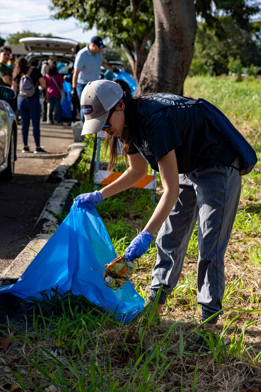 WAIPAHU, Hawaii (April 20, 2024) Volunteers from Navy Closure Task Force-Red Hill (NCTF-RH) team up with residents and other community members to clean trash and debris along the Kamakahi Stream and a portion of the bike trail. The volunteer event, sponsored by the City and County of Honolulu, brought together residents and various organizations from across the community in recognition of Earth Day 2024. Charged with the safe decommissioning of the Red Hill Bulk Fuel Storage Facility, NCTF-RH was established by the Department of the Navy as a commitment to the community and the environment. (U.S. Navy photo by Mass Communication Specialist 1st Class Luke McCall)