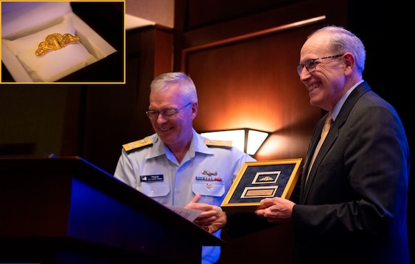 Adm. Poulin presented insignia #001 to Cal Lederer, current Deputy Judge Advocate General, who served as Acting Judge Advocate General during the Deepwater Horizon response.