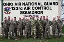 Airmen assigned to the 123rd Air Control Squadron pose for a portrait alongside service members from Lithuania and Hungary during a joint training exercise March 22, 2024, in Blue Ash, Ohio. The training included air battle management, ground control intercept, large-force employment and air-to-air combat beyond visual range.