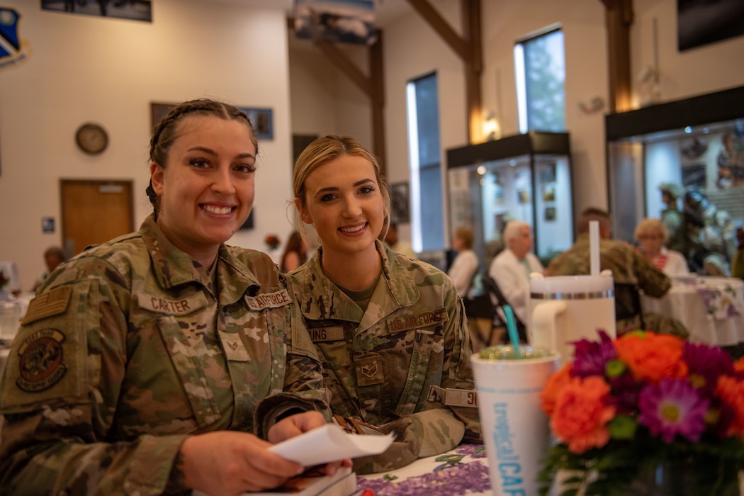 U.S. Air Force Senior Airman Jamie Anderson and Senior Airman Kenzie Young, assigned to the 23rd Wing, attend the Widows and Widowers connection group event at Moody Air Force Base, Georgia, April 17, 2024. The Widows and Widowers Connection & Support Group is a program that ensures the men and women who have paid the ultimate sacrifice for their country will never be forgotten. (U.S. Air Force photo by 2nd Lt. Benjamin Williams)