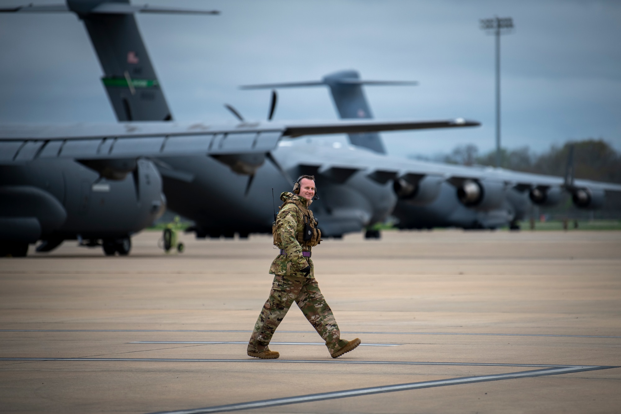 U.S. Air Force Chief Master Sgt. Jeremy Field, the 721st Contingency Response Squadron senior enlisted leader, walks along the flight line during Exercise STORM FLAG at Alexandria International Airport, Louisiana, March 9, 2024.