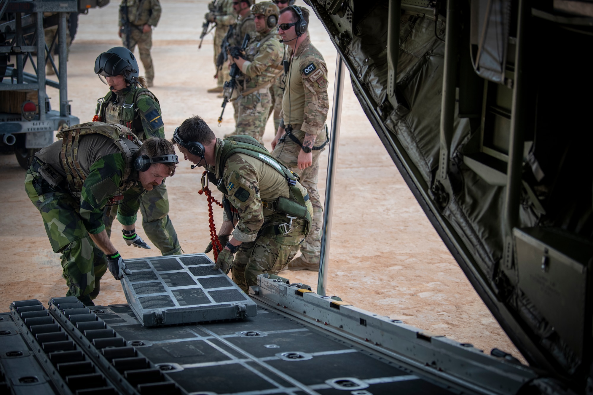 Members with the 721st Contingency Response Squadron work alongside Airmen with the Swedish Air Force during Exercise STORM FLAG at Alexandria International Airport, Louisiana, March 12, 2024. The