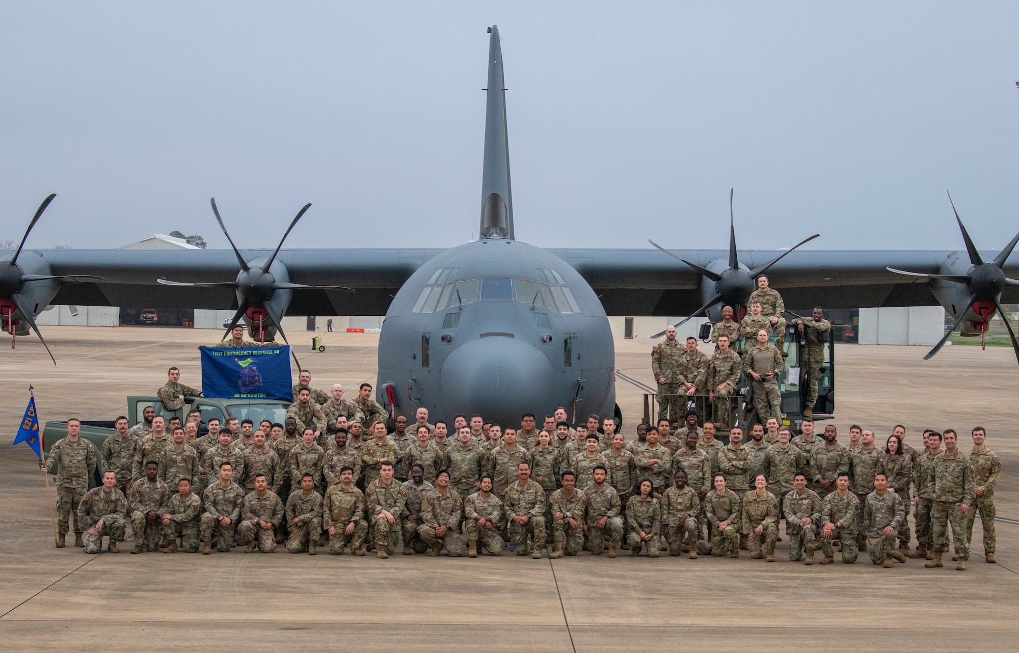 Members with the 721st Contingency Response Squadron pose for a photo during Exercise STORM FLAG 24-05 with a C-130 Hercules aircraft at Alexandria International Airport, Louisiana, March 14, 2024.