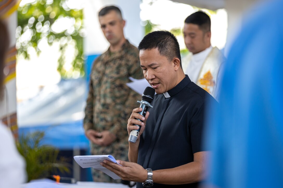 Richard Calunod Adalim, a chaplain with the Roman Catholic Church, officiates an interfaith ceremony during a ‘Bundles of Joy’ event held before Exercise Balikatan 24 at San Agustin Elementary School in San Fernando, La Union, Philippines, April 13, 2024. The ‘Bundle of Joy’ delivery consisted of televisions, laptops, printers, and school supplies to improve the learning environment for students, staff, and San Agustin Elementary School faculty. BK 24 is an annual exercise between the Armed Forces of the Philippines and the U.S. military designed to strengthen bilateral interoperability, capabilities, trust, and cooperation built over decades of shared experiences. (U.S. Marine Corps photo by Cpl. Trent A. Henry)