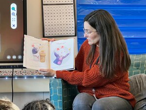 Woman reads book.