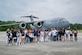 Local area students pose for a photo after flying in a C-17 Globemaster III during the Charleston Air Show at Joint Base Charleston, South Carolina, April 19, 2024. The airshow offered more than 50 demonstrations and displays including science, technology, engineering and mathematics exhibits, static display aircraft and aerial demonstration performances like the U.S. Air Force Thunderbirds, C-17 Globemaster III, and F-35B Lightning II. (U.S. Air Force photo by Airman 1st Class Carl Good)