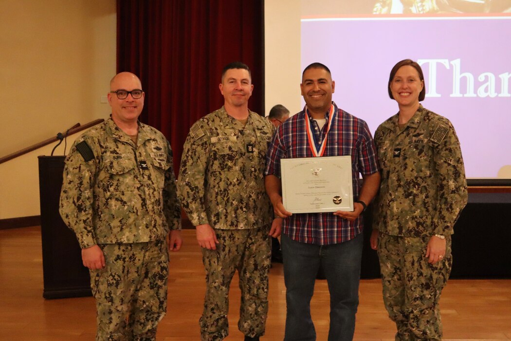 Mr. Jason Obregon, Naval Hospital Camp Pendleton operations management department, received the President’s Lifetime Achievement Award during the Marine Corps Installations West / Marine Corps Base Camp Pendleton 25th Annual Volunteer Recognition Ceremony held at the Pacific Views Event Center on April 18, 2024. Obregon is shown with the NHCP Triad of left to right, Navy Captain Jose Suris, acting executive officer, Master Chief Petty Officer Wayne George, command master chief, and hospital director, Navy Capt. Jenny Burkett.