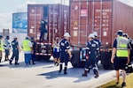 U.S. Coast Guard Forces Micronesia/Sector Guam personnel spearhead a comprehensive Multi-Agency Strike Force Operation (MASFO), meticulously inspecting 172 containers at the Port of Guam, on April 18, 2024. This operation is part of ongoing efforts to ensure the safety and security of containerized cargo, which is crucial for the island's economy and environmental protection. The MASFO brought together various agencies, including the Guam Customs and Quarantine Agency, Port Authority Police, the U.S. Food and Drug Administration, and other law enforcement and regulatory bodies. (U.S. Coast Guard photo by Josiah Moss)