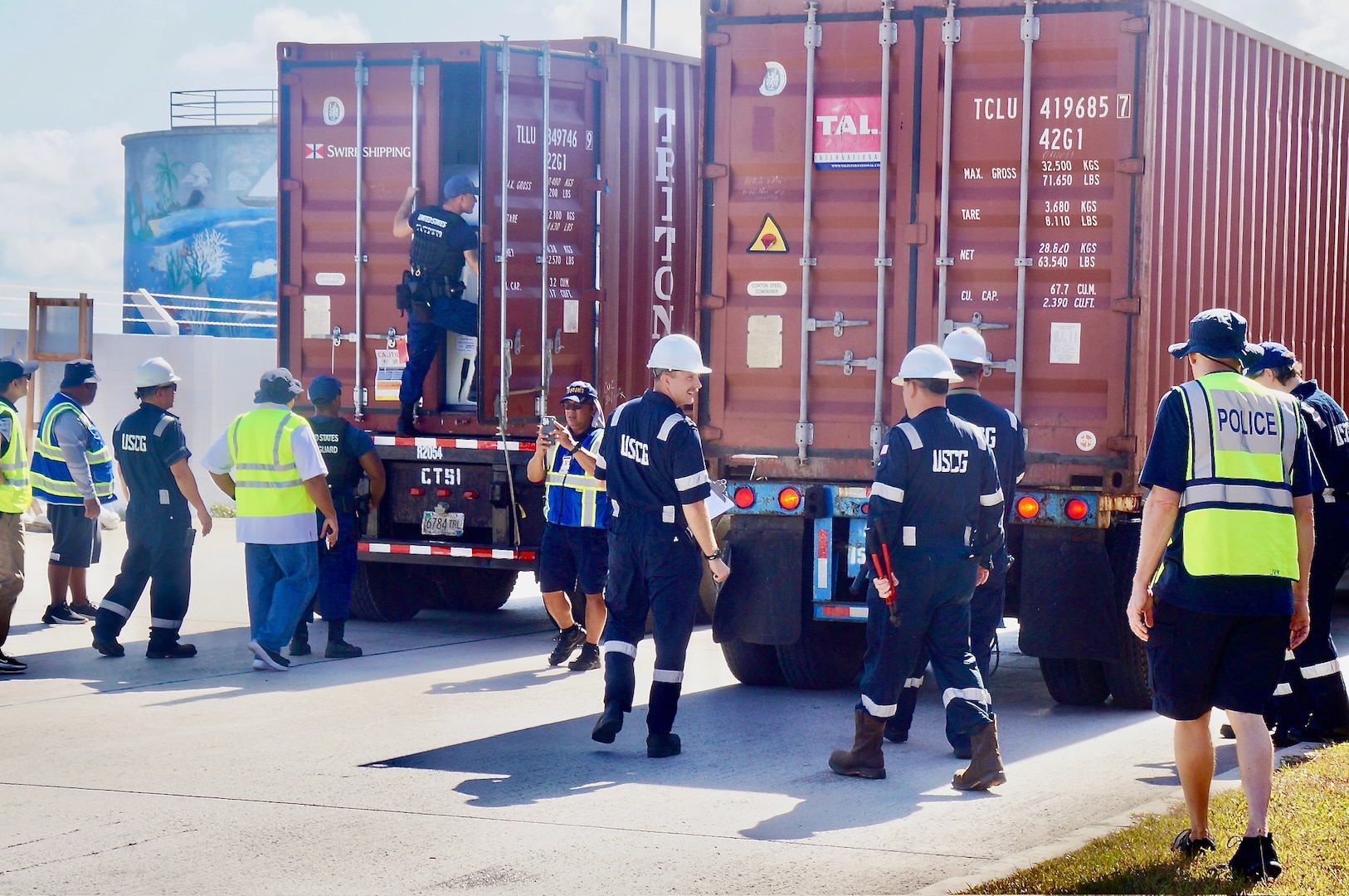 U.S. Coast Guard Forces Micronesia/Sector Guam personnel spearhead a comprehensive Multi-Agency Strike Force Operation (MASFO), meticulously inspecting 172 containers at the Port of Guam, on April 18, 2024. This operation is part of ongoing efforts to ensure the safety and security of containerized cargo, which is crucial for the island's economy and environmental protection. The MASFO brought together various agencies, including the Guam Customs and Quarantine Agency, Port Authority Police, the U.S. Food and Drug Administration, and other law enforcement and regulatory bodies. (U.S. Coast Guard photo by Josiah Moss)