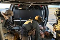 U.S Marines and Navy Search and Rescue Medical Technicians, assigned to Marine Aviation Weapons and Tactics Squadron One, prepare to offload a medical manikin from an Alaska Army National Guard UH-60L Black Hawk helicopter assigned to the 207th Aviation Troop Command during a casualty evacuation training exercise as part of Weapons and Tactics Instructor course 2-24, Marine Corps Air Station Yuma, Ariz., April 1, 2024.