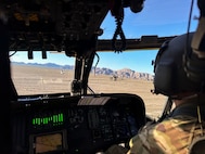 A U.S. Marine Corps UH-1Y Venom helicopter, left, assigned to Marine Aviation Weapons and Tactics Squadron One, and Alaska Army National Guard UH-60L Black Hawk helicopters assigned to the 207th Aviation Troop Command, conduct flight operations during the Weapons and Tactics Instructor course 2-24 near Marine Corps Air Station Yuma, Ariz., April 3, 2024.