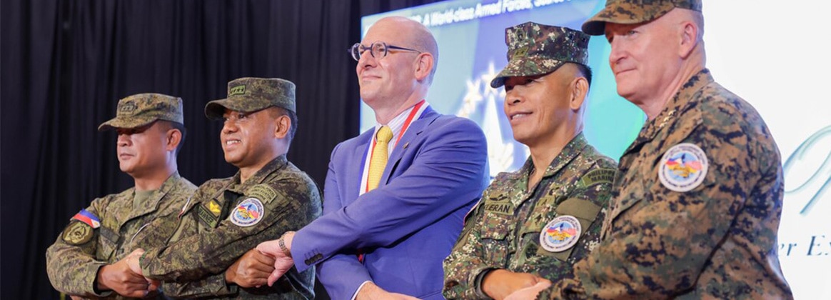 240422-M-KU714-1124 PHILIPPINES (April 22, 2024) Philippine and U.S. government and military representatives conduct the “crossing of hands” during the opening ceremony to commence Balikatan 24 at Camp Aguinaldo, Manila, Philippines, April 22, 2024. BK 24 is an annual exercise between the Armed Forces of the Philippines and the U.S. military designed to strengthen bilateral interoperability, capabilities, trust, and cooperation built over decades of shared experiences (U.S. Marine Corps Lance Cpl. Erica Stanke)