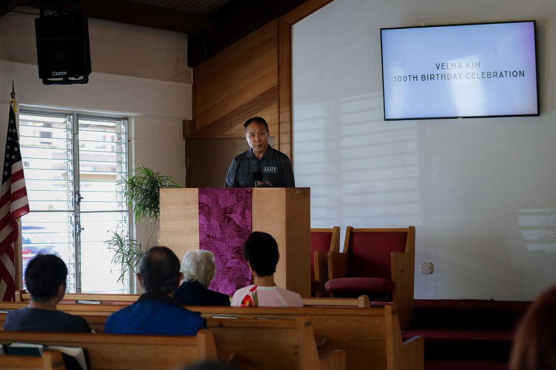 Dr. Andrew H.N. Kim U.S. Army Col, retired, gives a speech regarding his mother Velma P. Kim, centenarian U.S. Army spouse, back story at Wahiawa United Church of Christ April 21, 2024. The congregation, and close friends gathered to honor Velma's lifetime of contributions supporting the military, family, and her community.  (U.S. Army photo by Staff Sgt. Andre Taylor)