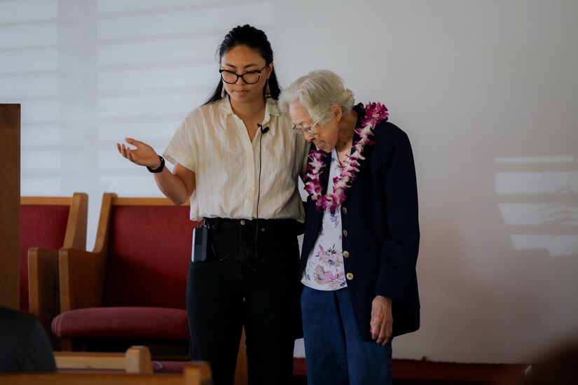 Cassie L. Chee, left, provides a prayer for Velma P. Kim, centenarian U.S. Army spouse, during a sermon as part of her 100th birthday celebration at the Wahiawa United Church of Christ April 21, 2024. The congregation, and close friends gathered to honor Velma's lifetime of contributions supporting the military, family, and her community.  (U.S. Army photo by Staff Sgt. Andre Taylor)