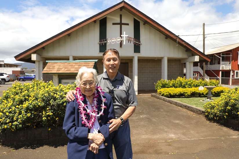 Dr. Andrew H.N. Kim, U.S. Army Col, retired, left, joined his mother Velma P. Kim, centenarian U.S. Army spouse at Wahiawa United Church of Christ to celebrate her 100th birthday on April 21, 2024. Members of the Wahiawa United Church of Christ threw a potluck bash honoring Velma's amazing century of service to the military, her family, and the community.  (U.S. Army photo by Staff Sgt. Andre Taylor)