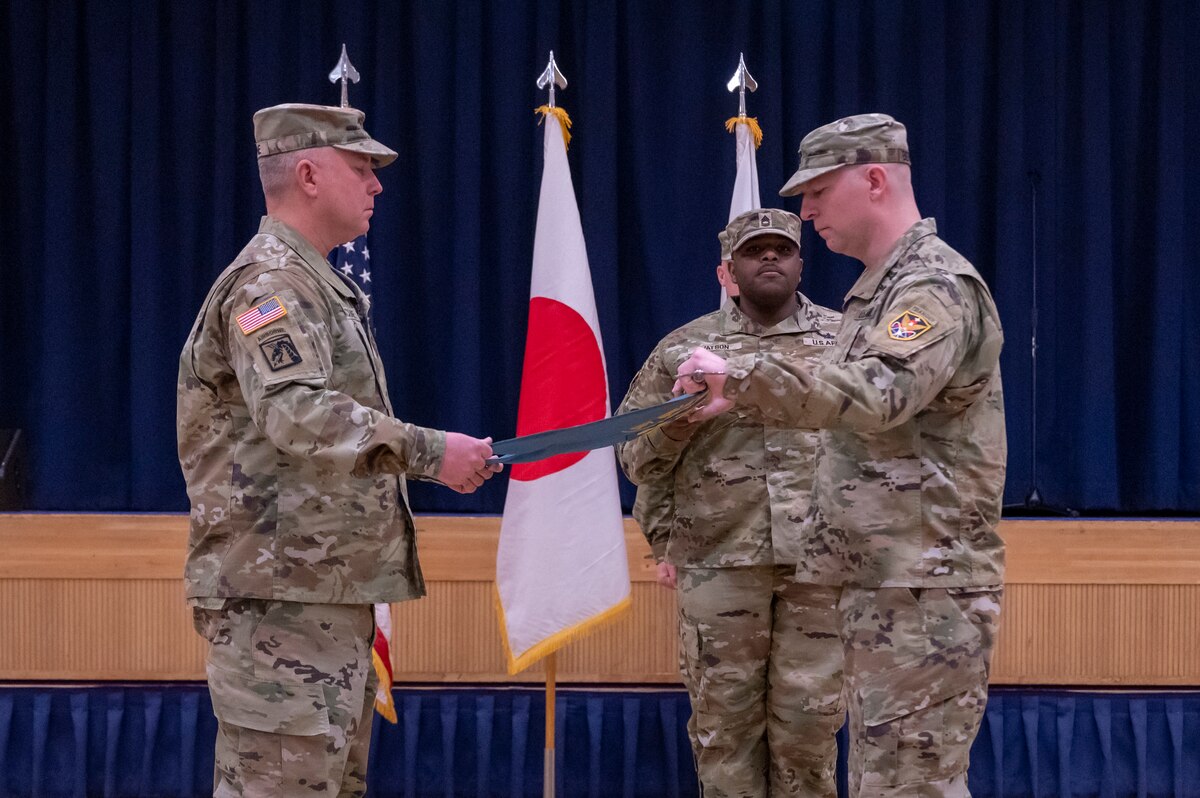The 22nd Space Company command team folds the company guidon during a deactivation ceremony at Misawa Air Base, Japan, April 12, 2024.