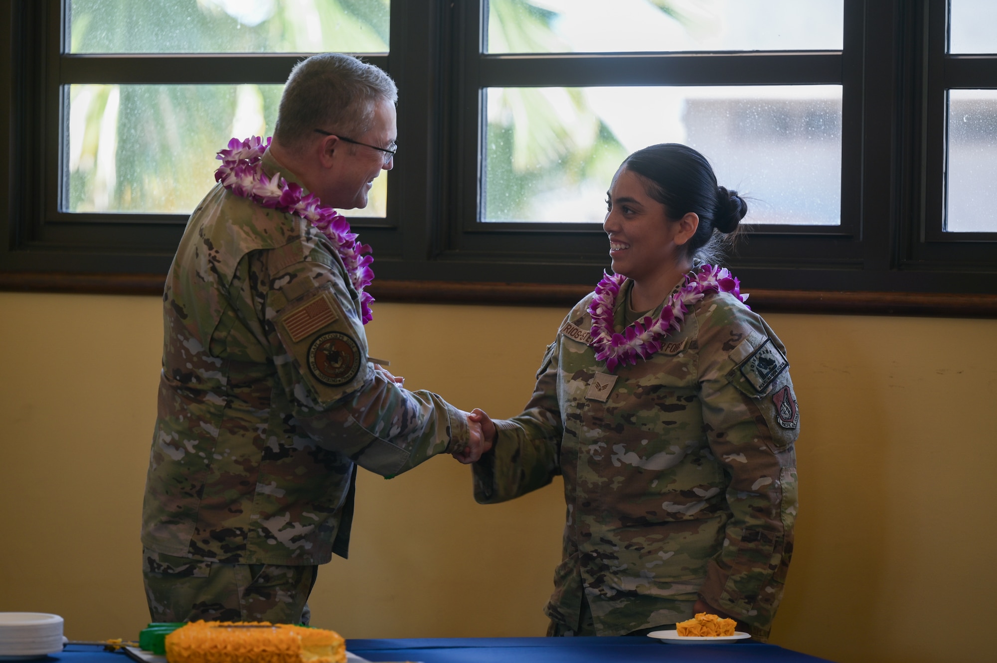 Chaplain gives Airman a coin.
