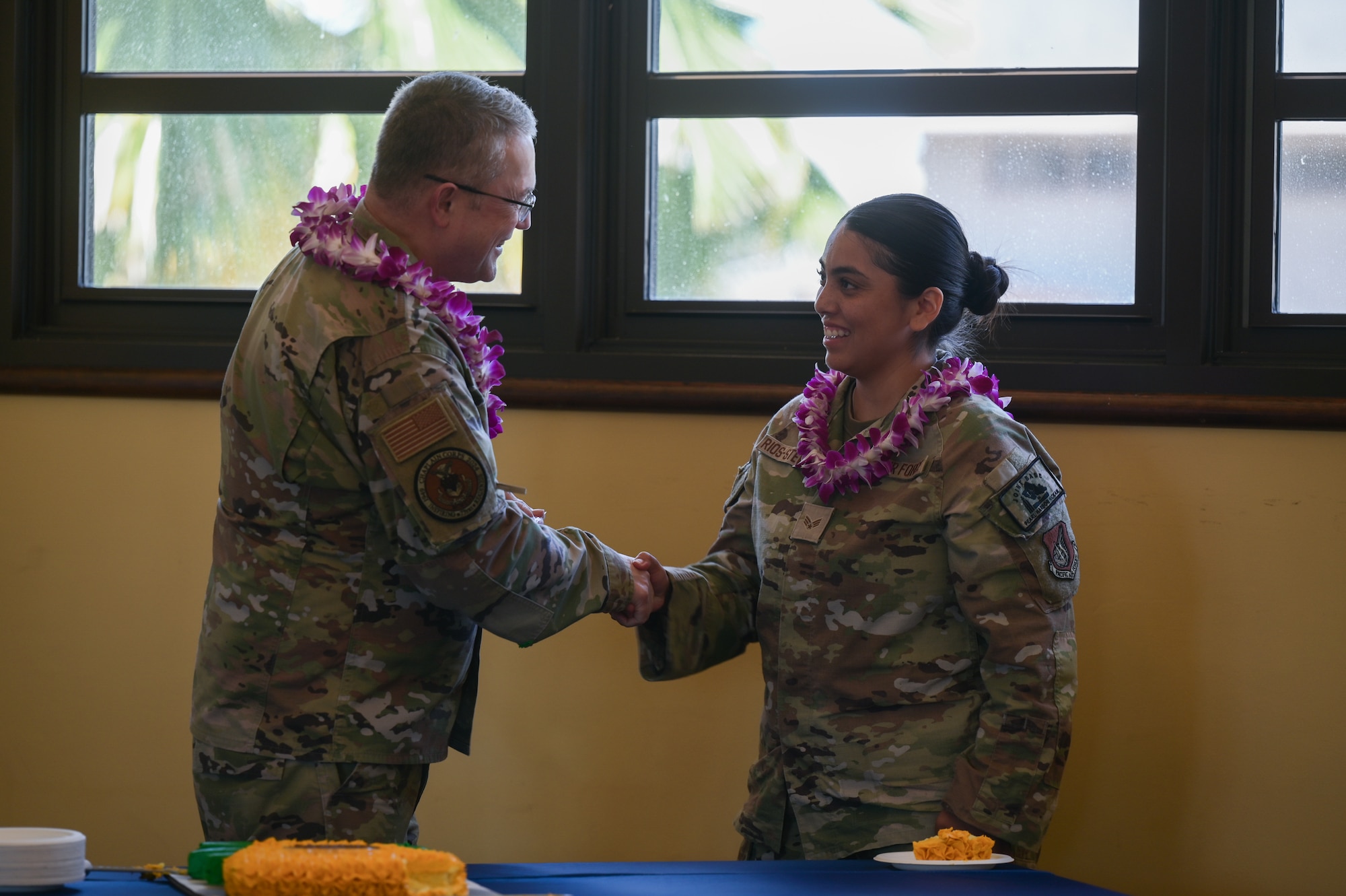 Maj. Gen. Randall Kitchens, U.S. Air Force Chief of Chaplains, coins Senior Airman Maribel Rios-Stewart, 647th Air Base Group religious affairs journeyman, during a 75th Chaplain Corp Anniversary celebration at Joint Base Pearl Harbor-Hickam, April 23, 2024. Kitchens coined and gifted Rios-Stewart with a 75th anniversary coin and patch. (U.S. Air Force photo by Staff Sgt. Alan Ricker)