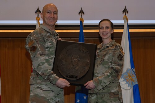U.S. Air Force Maj. Kristen Ober receives the Lance P. Sijan Leadership Award from Air Force Chief of Staff Gen. David Allvin during a commander’s call at Kadena Air Base, Japan, April 6, 2024 for exceptional leadership qualities, embodying the fundamental values of the U.S. Air Force. (Courtesy photo)