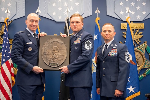 Air Force Chief of Staff Gen. David Allvin presents Master Sgt. Thomas R. Johnson the Lance P. Sijan Leadership Award in the Pentagon Hall of Heroes in Arlington, Va., April 8, 2024, for exceptional leadership qualities, embodying the fundamental values of the U.S. Air Force. (U.S. Air Force photo by Tech. Sgt. William A. O’Brien)
