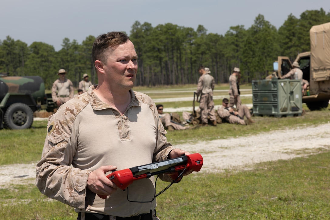 U.S. Marine Corps Master Sgt. Todd Grindstaff, a native of Missouri and a weapons and tactics training chief with Headquarters and Service Battery, 2nd Low Altitude Air Defense (LAAD) Battalion, operates a drone during a counter-unmanned aircraft system (UAS) range on Marine Corps Base Camp Lejeune, North Carolina, April 16, 2024. 2nd LAAD Battalion conducted a dynamic, tactical scenario-driven counter-UAS aerial-gunnery range in which Marines had to shoot, maneuver, and communicate while directly engaging UAS aircraft. (U.S. Marine Corps photo by Lance Cpl. Anakin Smith)