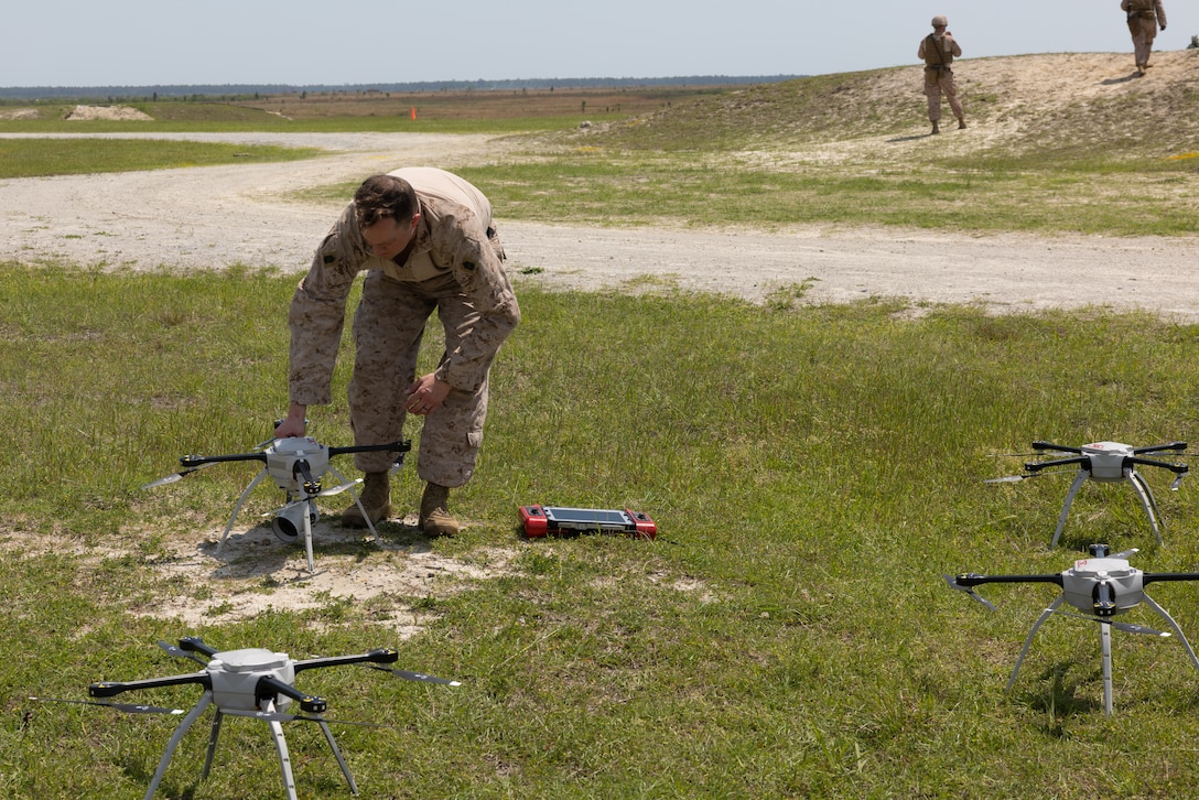 U.S. Marine Corps Master Sgt. Todd Grindstaff, a native of Missouri and a weapons and tactics training chief with Headquarters and Service Battery, 2nd Low Altitude Air Defense (LAAD) Battalion, prepares drones for a counter-unmanned aircraft system (UAS) range on Marine Corps Base Camp Lejeune, North Carolina, April 16, 2024. 2nd LAAD Battalion conducted a dynamic, tactical scenario-driven counter-UAS aerial-gunnery range in which Marines had to shoot, maneuver, and communicate while directly engaging UAS aircraft. (U.S. Marine Corps photo by Lance Cpl. Anakin Smith)