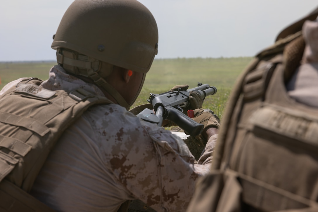 U.S. Marine Corps Cpl. Shavoci Jones, left, a native of Illinois and a low-altitude air-defense (LAAD) gunner with Bravo Battery, 2nd LAAD Battalion, loads an M1014 shotgun during a counter-unmanned aircraft system (UAS) range on Marine Corps Base Camp Lejeune, North Carolina, April 16, 2024. 2nd LAAD Battalion conducted a dynamic, tactical scenario-driven counter-UAS aerial-gunnery range in which Marines had to shoot, maneuver, and communicate while directly engaging UAS aircraft. (U.S. Marine Corps photo by Lance Cpl. Anakin Smith)
