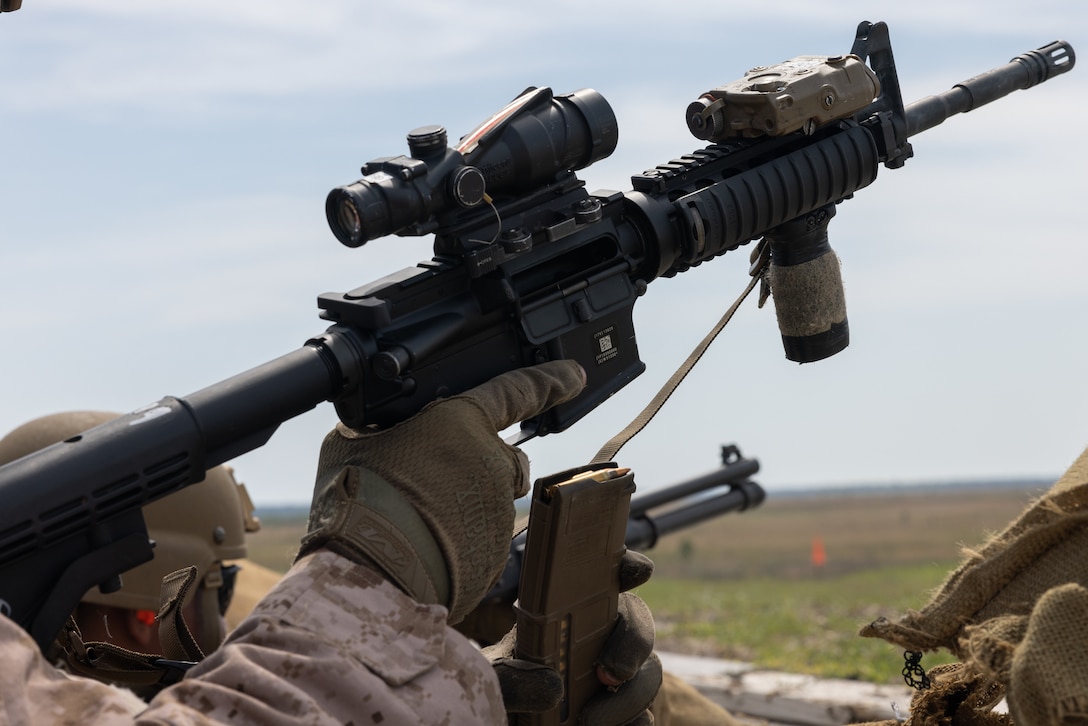 U.S. Marine Corps Lance Cpl. Zackery Potter, a native of Pennsylvania and a low-altitude air-defense (LAAD) gunner with Bravo Battery, 2nd LAAD Battalion, loads an M4 carbine during a counter-unmanned aircraft system (UAS) range on Marine Corps Base Camp Lejeune, North Carolina, April 16, 2024. 2nd LAAD Battalion conducted a dynamic, tactical scenario-driven counter-UAS aerial-gunnery range in which Marines had to shoot, maneuver, and communicate while directly engaging UAS aircraft. (U.S. Marine Corps photo by Lance Cpl. Anakin Smith)