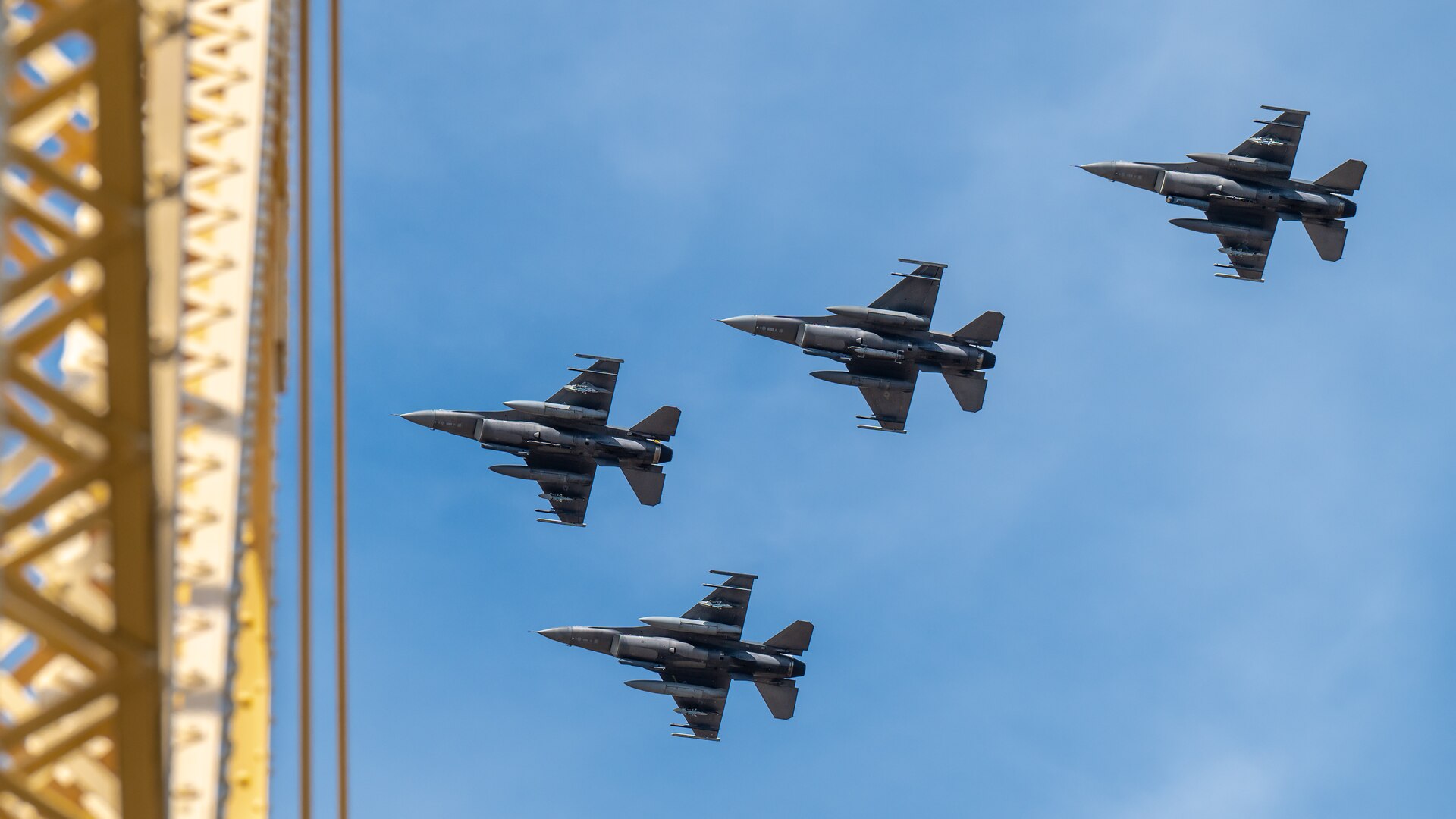 Four F-16 Fighting Falcons from the Ohio Air National Guard’s 180th Fighter Wing in Toledo, Ohio, steak over the Clark Memorial Bridge to kick off the Thunder Over Louisville air show in Louisville, Ky., April 20, 2024. This year’s event featured more than two-dozen military and civilian aircraft, including the Kentucky Air National Guard’s C130J Super Hercules. (U.S. Air National Guard photo by Dale Greer)
