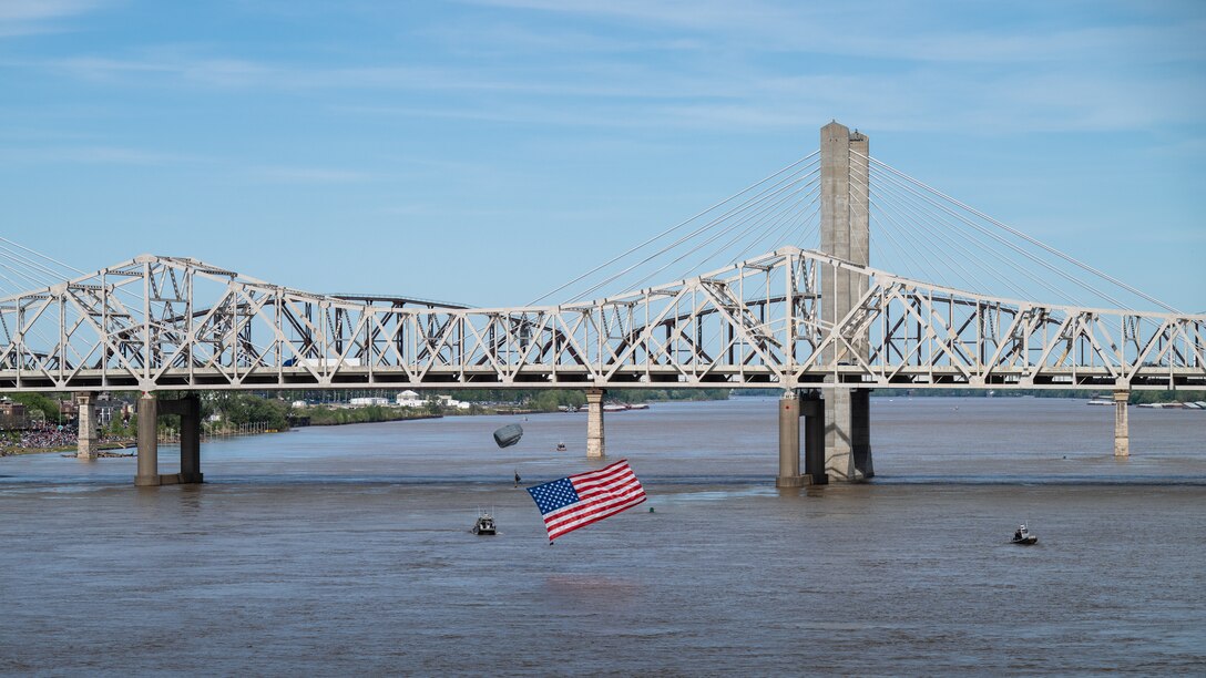 A pararescueman from the Kentucky Air National Guard’s 123rd Special Tactics Squadron parachutes into the Ohio River as part of a demonstration during the Thunder Over Louisville air show in Louisville, Ky., April 20, 2024. This year’s event featured more than two-dozen military and civilian planes, including the Kentucky Air National Guard’s C130J Super Hercules. (U.S. Air National Guard photo by Dale Greer)