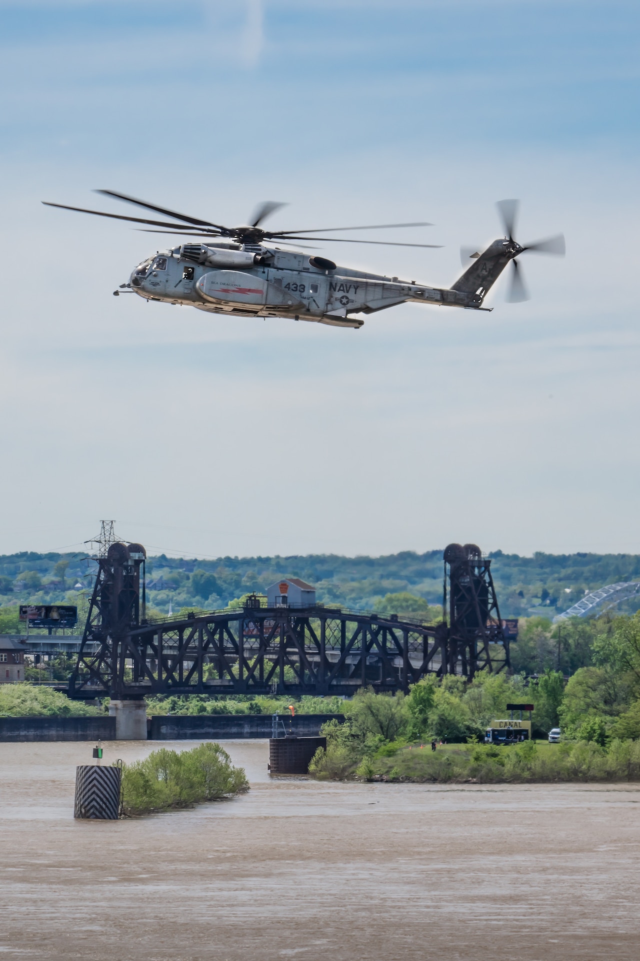 A U.S. Navy MH-53 Sea Dragon from Norfolk Naval Air Station, Va., performs an aerobatic display during the Thunder Over Louisville air show in Louisville, Ky., April 20, 2024. This year’s event featured more than two-dozen military and civilian aircraft, including the Kentucky Air National Guard’s C130J Super Hercules. (U.S. Air National Guard photo by Dale Greer)