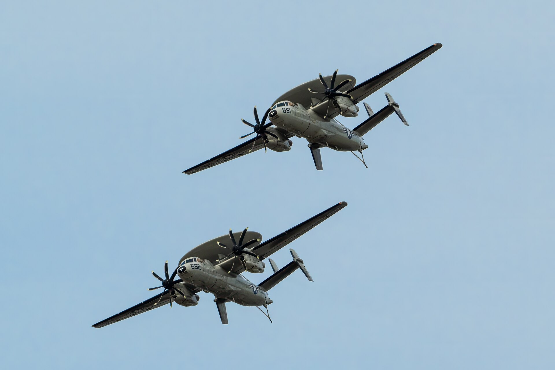 Two U.S. Navy E-2C Hawkeyes from Norfolk Naval Air Station, Va., perform an aerobatic display during the Thunder Over Louisville air show in Louisville, Ky., April 20, 2024. This year’s event featured more than two-dozen military and civilian aircraft, including the Kentucky Air National Guard’s C130J Super Hercules. (U.S. Air National Guard photo by Dale Greer)