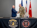Maj. Gen. Bill Crane, Adjutant General of the West Virginia National Guard, signs a Memorandum of Understanding with Dr. Dennis Walters, Director of the Irregular Warfare Center, during a Ridge Runner Irregular Warfare program ceremony at Camp Dawson, Kinwgood, West Virginia, April 19, 2024. The IWC advances Department of Defense irregular warfare concepts, doctrine, and education, in collaboration with U.S. Joint Forces, key Allies and Partner Nations. The memorandum of understanding helps formalize the WVNG/IWC relationship, including enhancing opportunities for joint training exercises such as Ridge Runner and Ridge Healer programs, and additional sponsored events. (U.S. Army National Guard photo by Edwin L. Wriston)