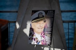 A memorial poster recognizes the service of the last survivor from battleship USS Arizona (BB-39), Louis Al. (Lou) Conter, during a ceremony on the USS Arizona memorial on April 23, 2024. Retired Lt. Cmdr. Conter first enlisted in 1939, and he served more than 27 years in the U.S. Navy, including as a pilot during the Korean War. Conter passed away April 1 at the age of 102, and he devoted much of his life to preserving the memory of the 2,403 Americans killed and 1,178 wounded during the attack on Pearl Harbor. (U.S. Navy photo by Chief Mass Communication Specialist Shannon M. Smith)
