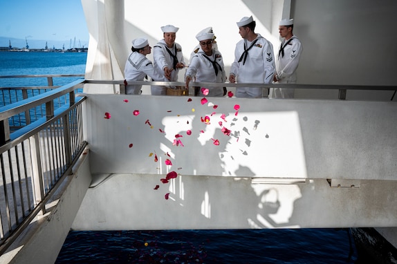 Sailors drop flower petals into the water during the memorial ceremony in honor of the last survivor from battleship USS Arizona (BB-39), Louis Al. (Lou) Conter, on April 23, 2024. Retired Lt. Cmdr. Conter first enlisted in 1939, and he served more than 27 years in the U.S. Navy, including as a pilot during the Korean War. Conter passed away April 1 at the age of 102, and he devoted much of his life to preserving the memory of the 2,403 Americans killed and 1,178 wounded during the attack on Pearl Harbor. (U.S. Navy photo by Chief Mass Communication Specialist Shannon M. Smith)