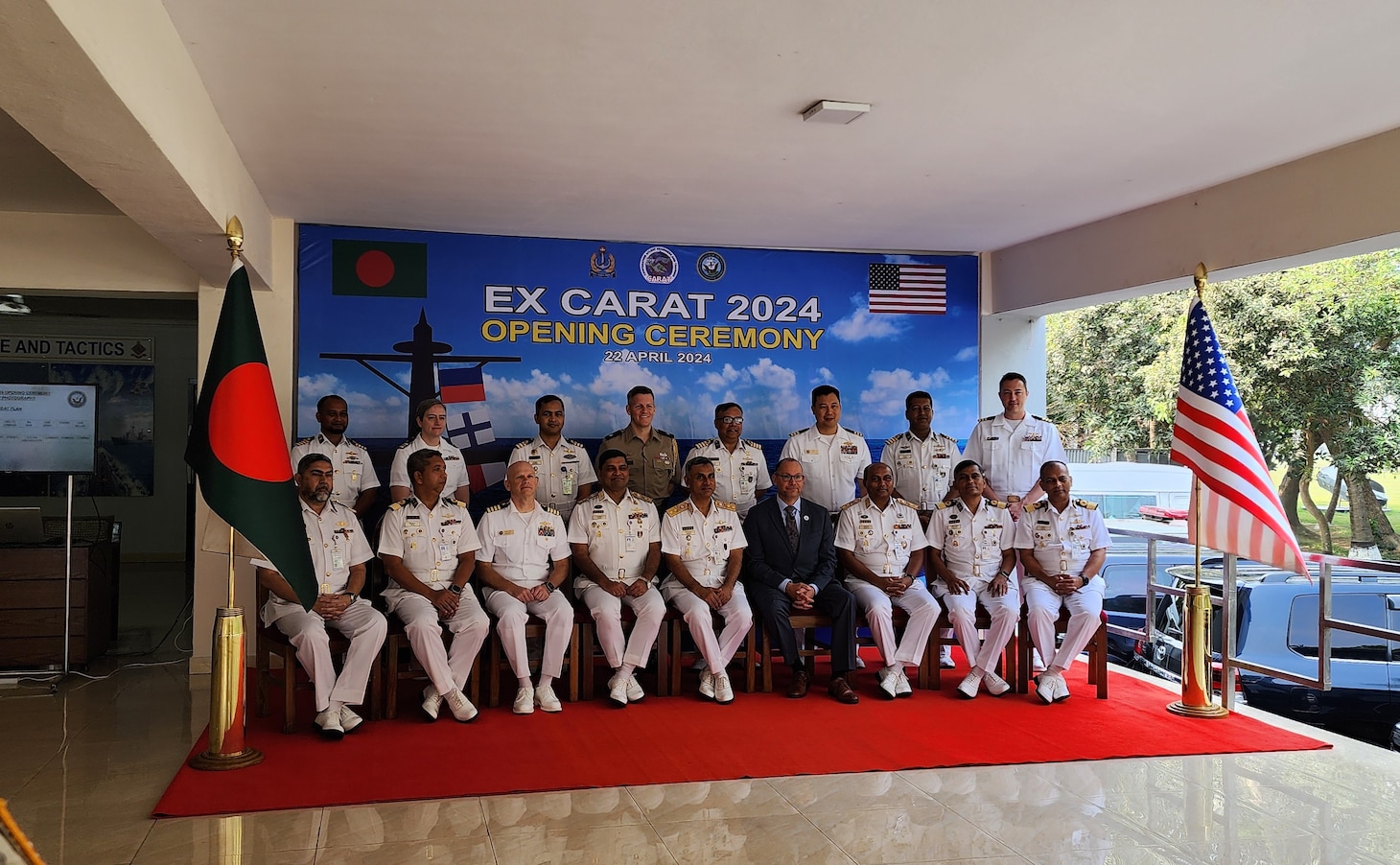 240422-N-NR876-1252 CHATTOGRAM, Bangladesh (April 22, 2024) - Distinguished guests from the U.S. Embassy to Bangladesh, Navy, Marine Corps, and Bangladesh Navy pose for a group photo after the opening ceremony of Cooperation Afloat Readiness and Training (CARAT) Exercise Bangladesh 2024 in Chattogram, Bangladesh Apr. 22. CARAT Bangladesh is a week-long exercise that seeks to enhance collaboration focused on shared maritime security challenges in the region. As the 30th iteration of the CARAT series, 2024 highlights the longstanding role of CARAT as a credible venue for regional Allies and partners to address shared maritime security priorities. (U.S. Navy photo by Chief Electronics Technician Nguyet Mai)
