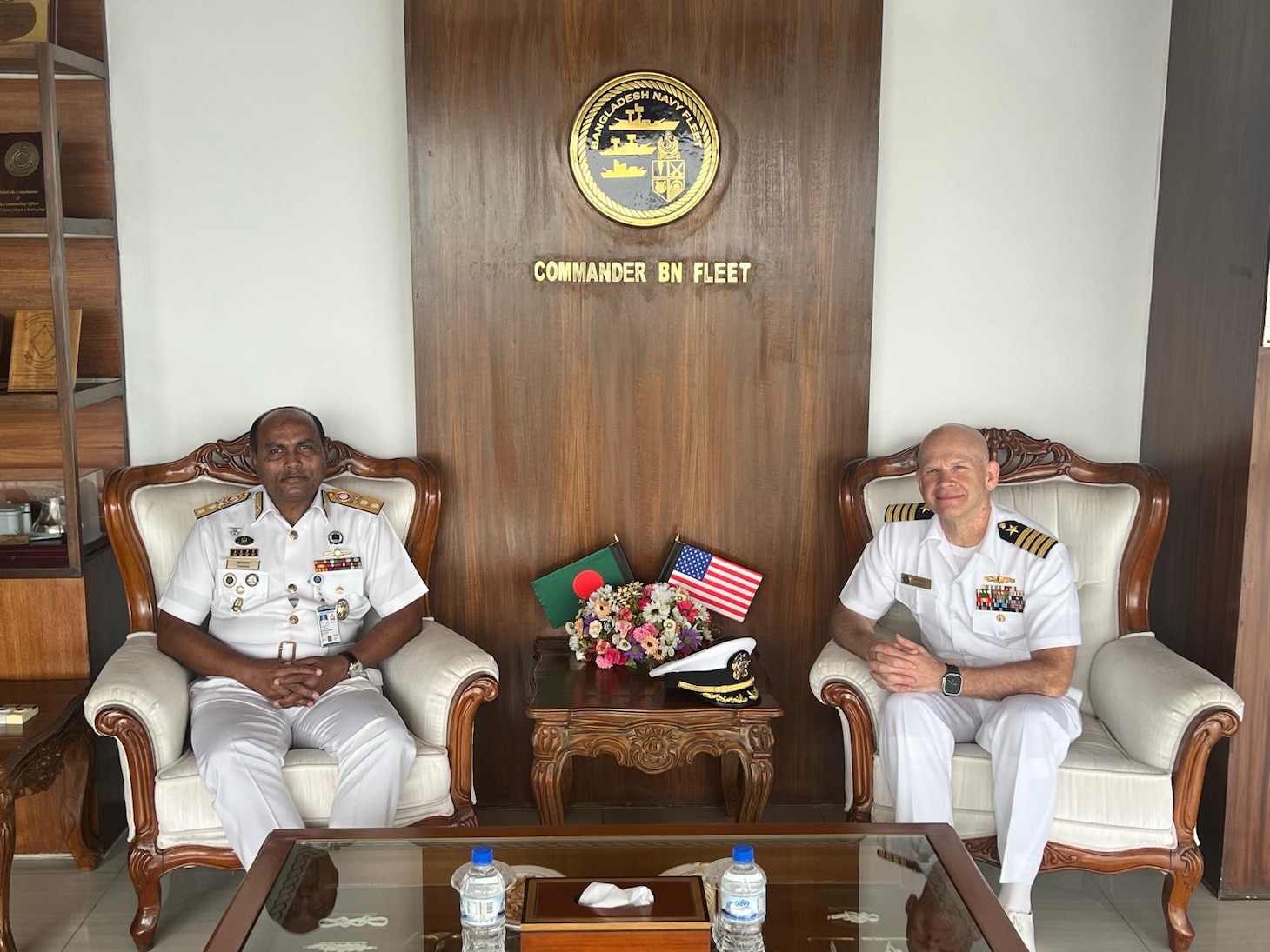 240422-N-NR876-1615 CHATTOGRAM, Bangladesh (April 22, 2024)- Capt. Matthew Scarlett, right, deputy commodore, Destroyer Squadron (DESRON) 7 poses for a photo with Bangladesh Navy Assistant Chief of Naval Staff (Operations), Rear Adm. Mohammad Anwar Hossain, left, during the opening ceremony for Cooperation Afloat Readiness and Training (CARAT) Exercise Bangladesh 2024. CARAT Bangladesh is a week-long exercise that seeks to enhance collaboration focused on shared maritime security challenges in the region. As the 30th iteration of the CARAT series, 2024 highlights the longstanding role of CARAT as a credible venue for regional Allies and partners to address shared maritime security priorities.