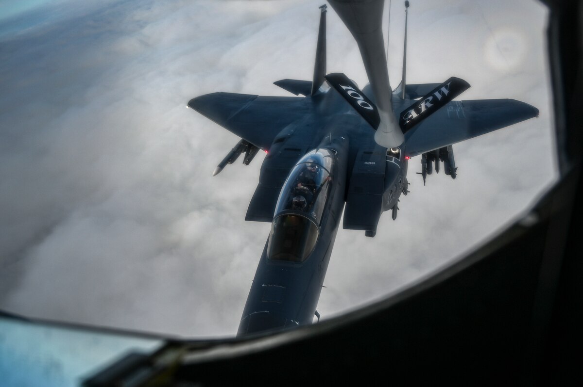 A U.S. Air Force F-15E Strike Eagle from the 48th Fighter Wing, Royal Air Force Lakenheath, England, receives fuel from a KC-135 Stratotanker from the 100th Air Refueling Wing, RAF Mildenhall, England, during aerial refueling operations over England, April 4, 2024.