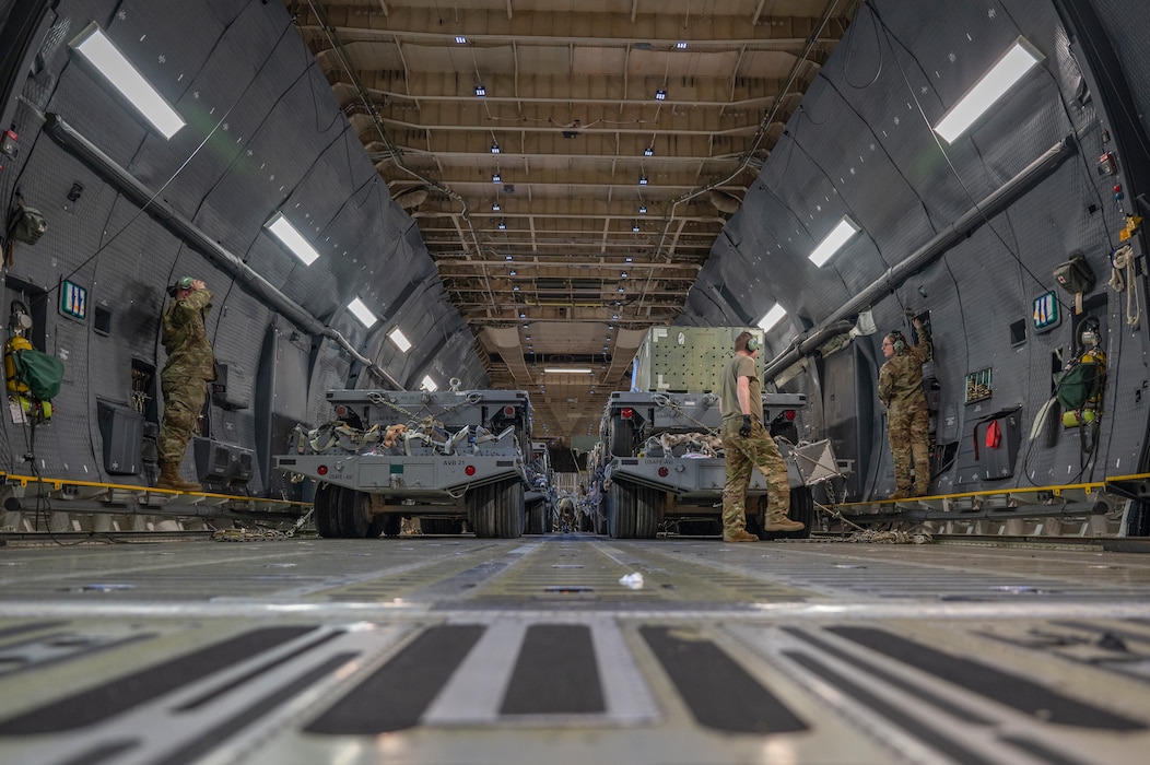 U.S. Air Force C-5 Galaxy loadmasters prepare to offload cargo at an undisclosed location, U.S. Central Command Area of Responsibility, April 22, 2024. The U.S. Air Force is globally postured to protect and defend freedom of coalition allies and regional partners to maintain peace and stability across the region. (U.S. Air Force photo)