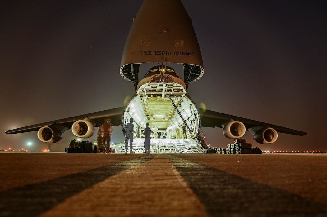 A U.S. Air Force C-5 Galaxy is positioned on the flightline at an undisclosed location, U.S. Central Command Area of Responsibility, April 22, 2024. As the Air Force’s largest strategic airlifter, the C-5 can carry more cargo farther distances than any other aircraft. (U.S. Air Force photo)