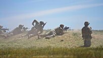 A fire team from the Oregon National Guard's 41st Infantry Brigade Combat Team fires at targets while conducting a squad live-fire exercise at Orchard Combat Training Center in Idaho  April 19, 2024. The intensive range tested Soldiers' abilities to maneuver under simulated combat conditions with pop-up targets and live ammunition.