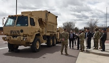 Col. Mark Cobos, commander, 1st Space Brigade, U.S. Army Space and Missile Defense Command, discusses Army space capabilities with Chief of Space Operations U.S. Space Force Gen. Chance Saltzman and Chief Master Sgt. of the Space Force John F. Bentivegna during a visit to the brigade headquarters at Fort Carson, Colorado, April 10. (U.S. Army photo by Dottie White)