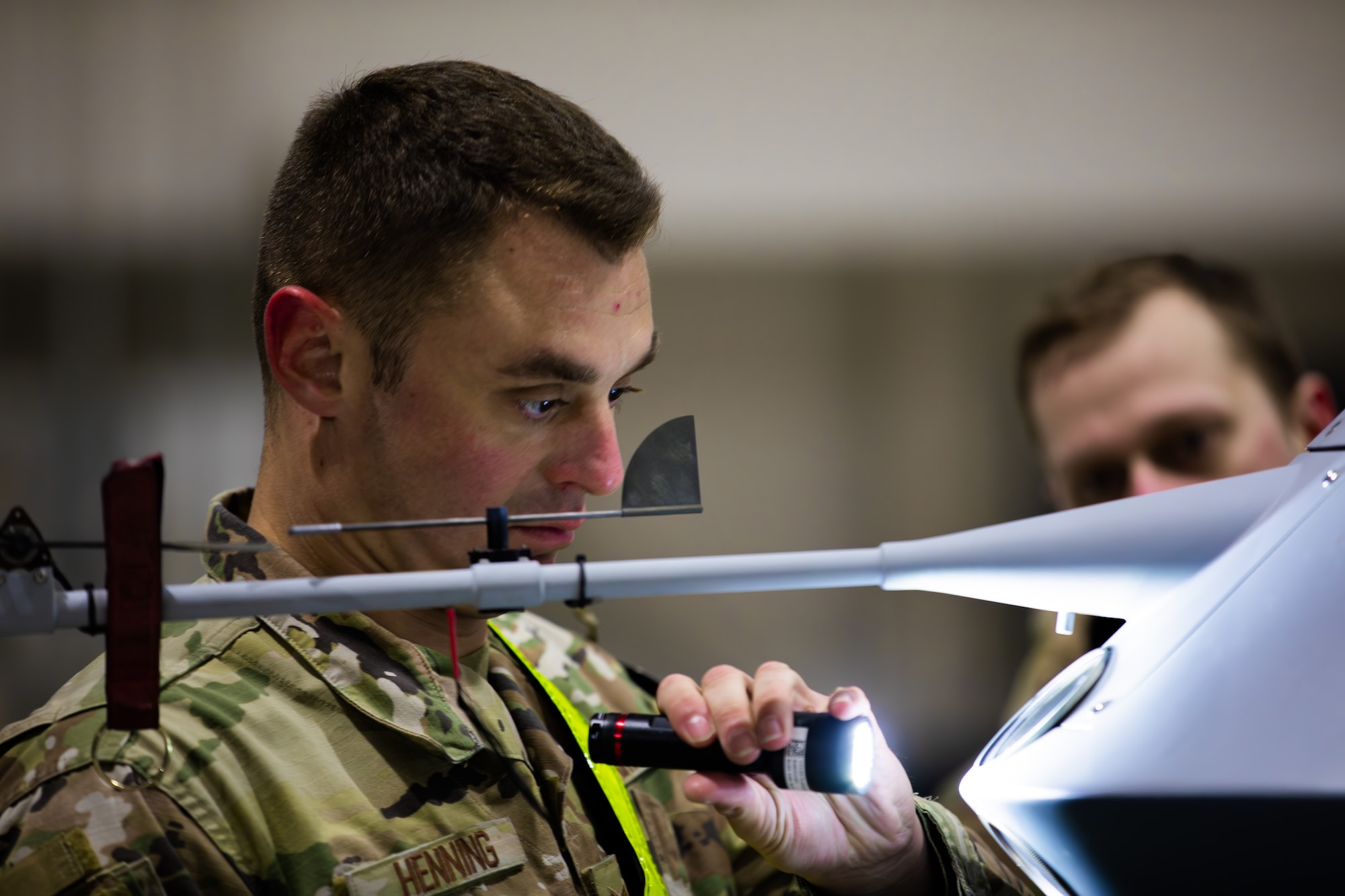 Tech Sgt. Todd Henning, an airman assigned to the 163rd Aircraft Maintenance Squadron inspects a remotely piloted MQ-9 Reaper in a 178th Wing hanger on Springfield-Beckley Air National Guard Base, Ohio, March 12, 2024. Exercise Advanced Wrath provides the 178th Wing with an opportunity to work with airmen from across the country. (U.S. Army National Guard photo by Staff Sgt. Thomas Moeger)