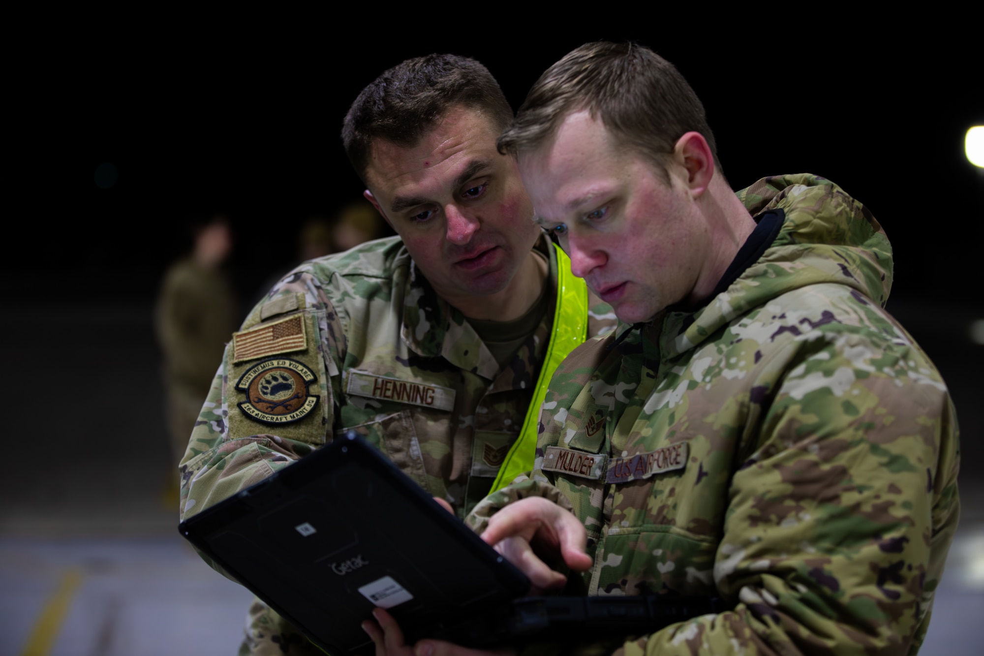 Staff Sgt. Mulder and Tech Sgt. Todd Henning, airmen assigned to the 163rd Aircraft Maintenance Squadron look at a field laptop during an MQ-9 Reaper inspection at the 178th Wing on Springfield-Beckley Air National Guard Base, Ohio, March 12, 2024. According to a Congressional Research Service report in 2023, an MQ-9 Reaper costs about $30 million. (U.S. Army National Guard photo by Staff Sgt. Thomas Moeger)