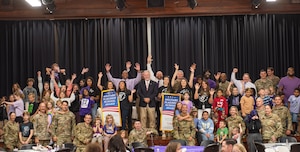 U.S. Airmen, Lanier County military children, Moody Air Force Base and Georgia Department of Education representatives pose for a picture